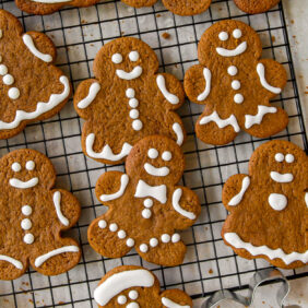 iced gingerbread man cookies on wire cooling rack