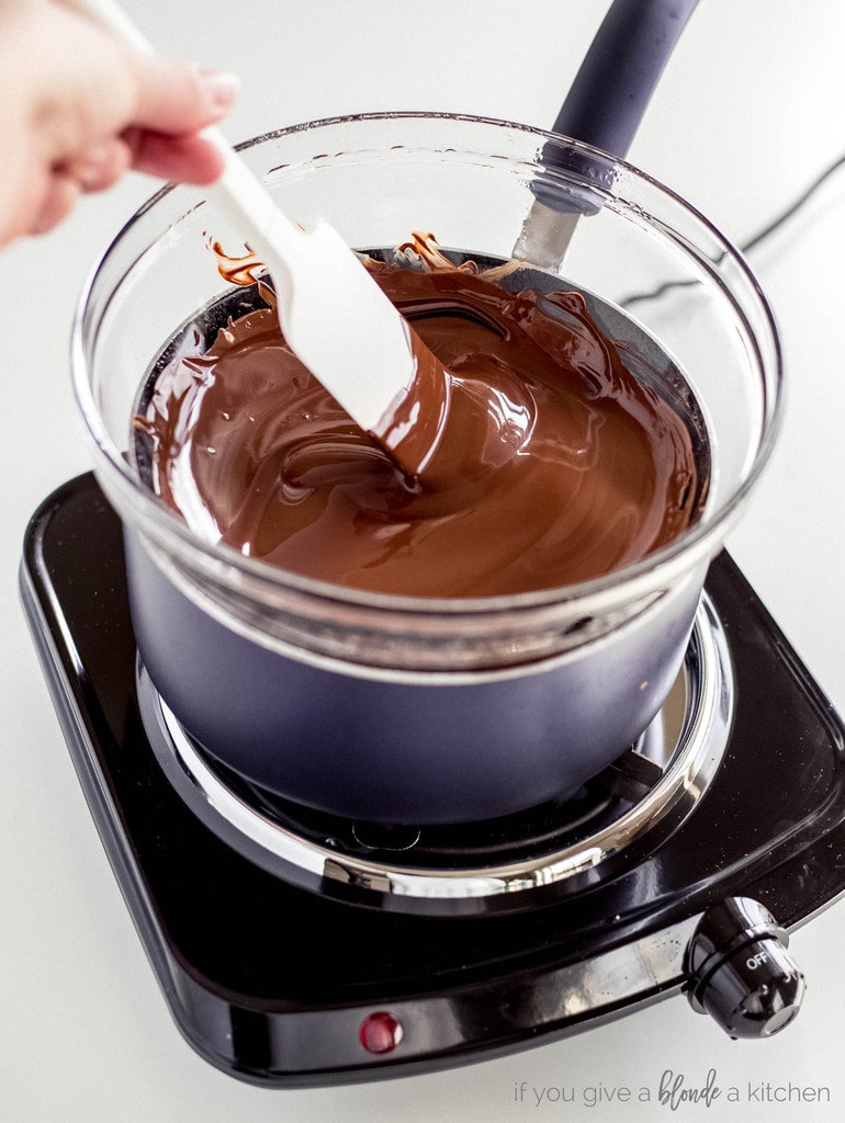 melted chocolate in bowl of makeshift double boiler