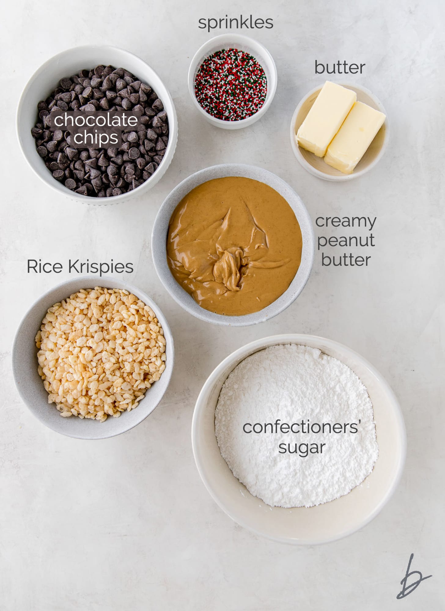 peanut butter balls ingredients in bowls labeled with text