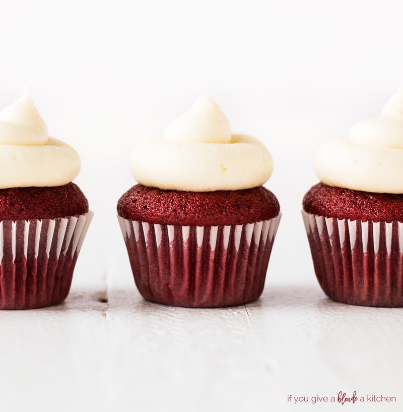 mini red velvet cupcakes close up with cream cheese frosting