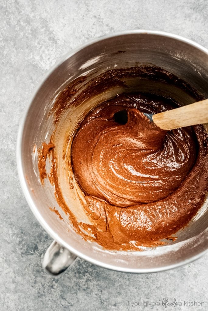 mixing bowl with brownie batter and spatula