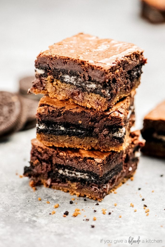 stack of three cookie dough oreo brownies showing layers