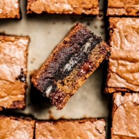 side of cookie dough oreo brownie in pan of brownie squares