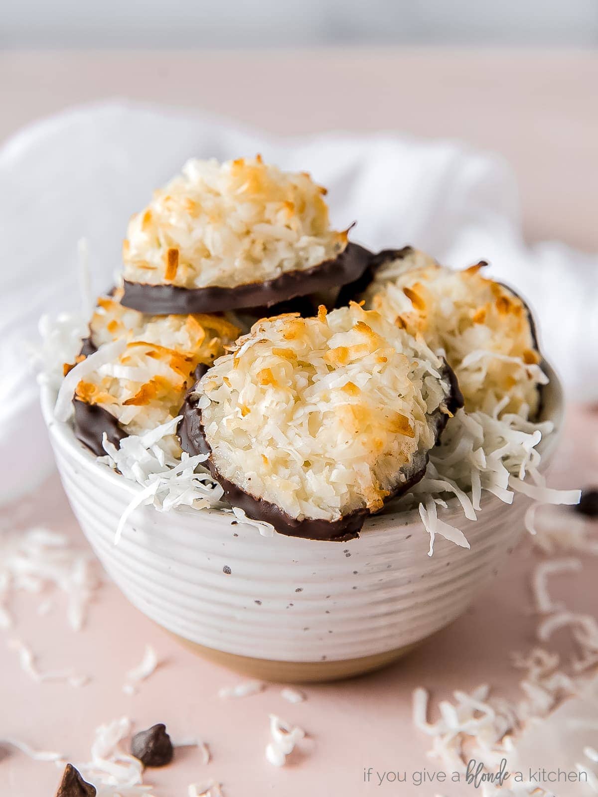 coconut macaroons and shredded coconut in a small bowl