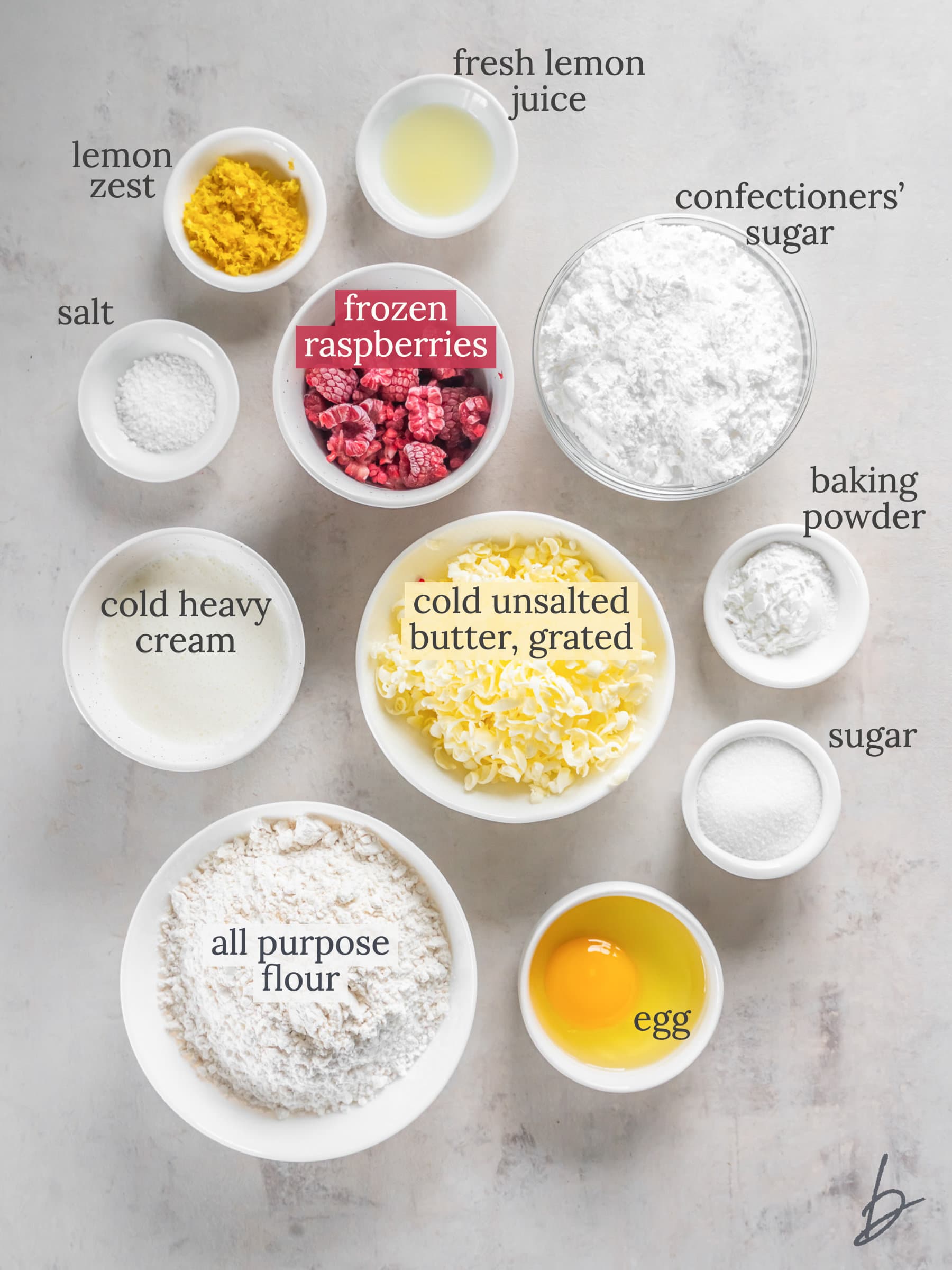 ingredients for lemon raspberry scones in bowls labeled with text.