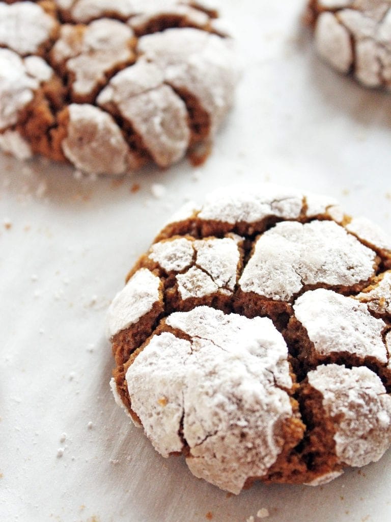 chewy gingerbread crinkle cookies with powdered sugar