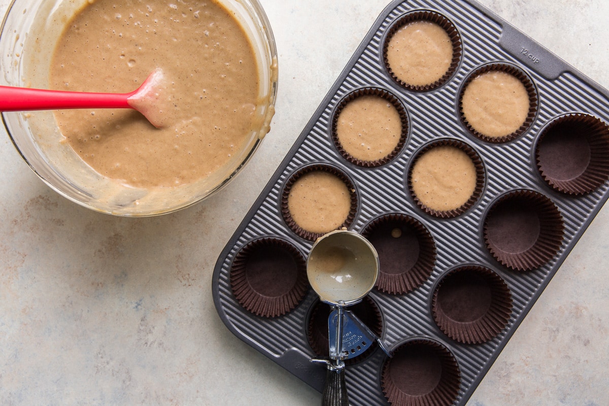 mixing bow and muffin tin filled with rum cupcake batter