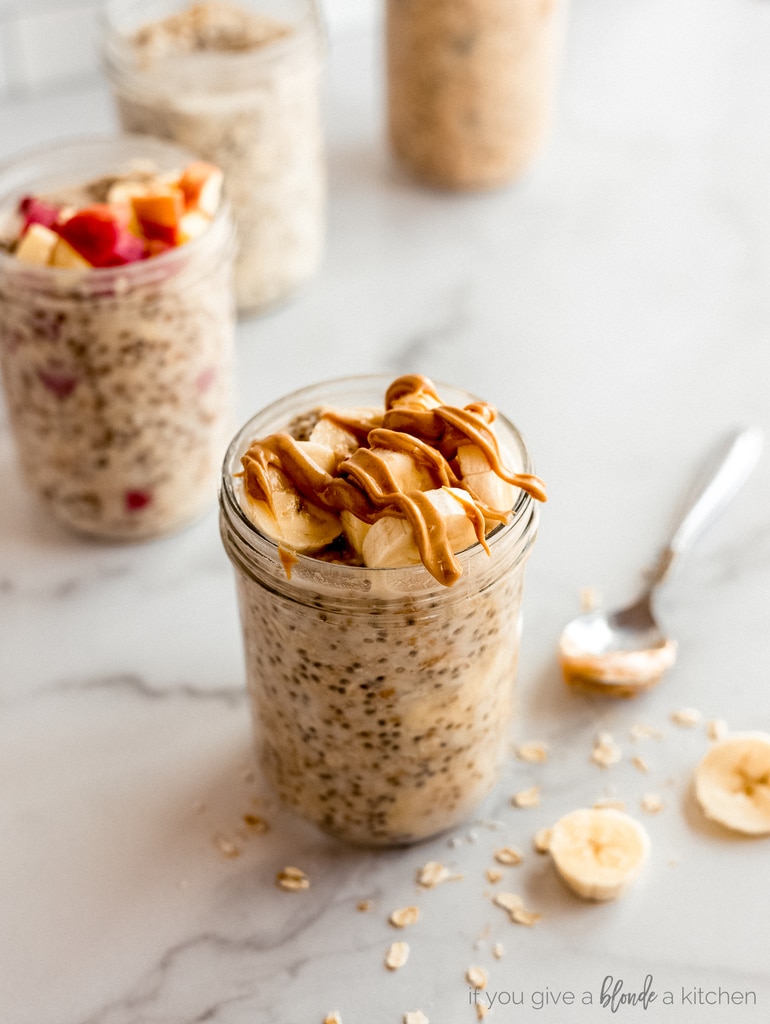 peanut butter drizzled on bananas in overnight oats jar