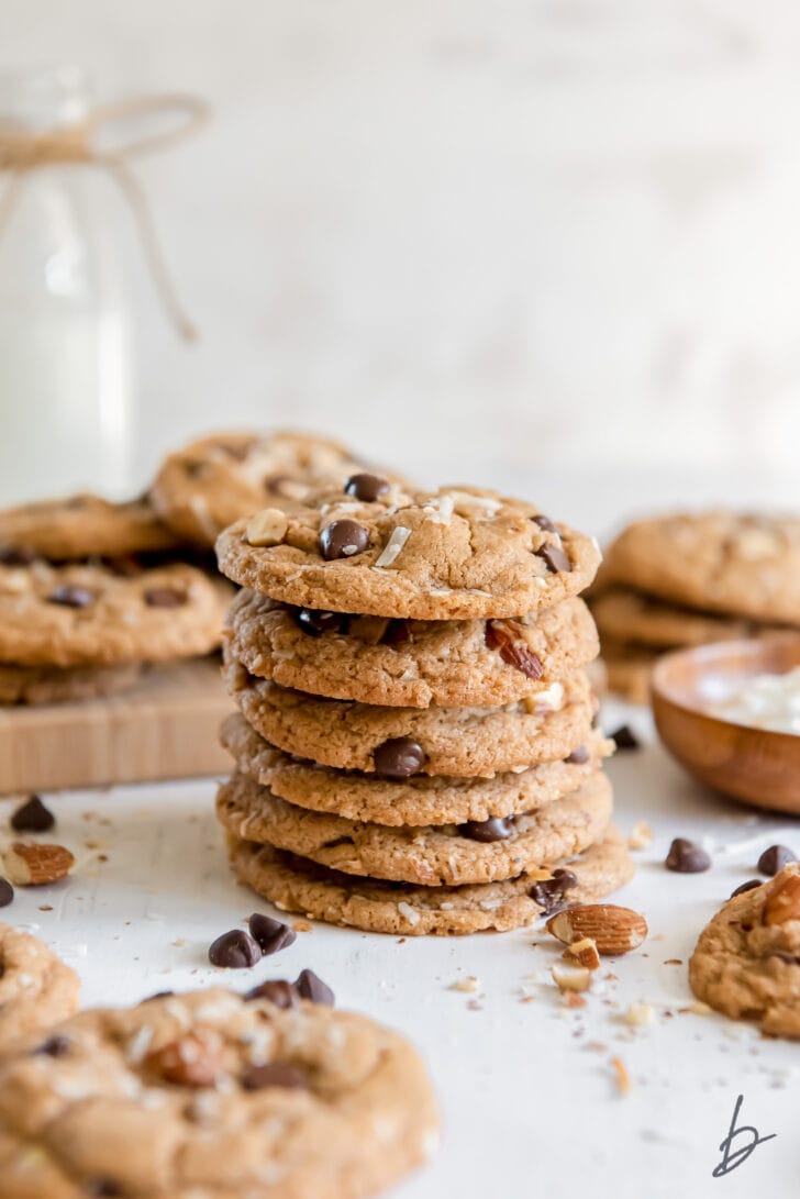 stack of six almond butter cookies with chocolate chips and shredded coconut