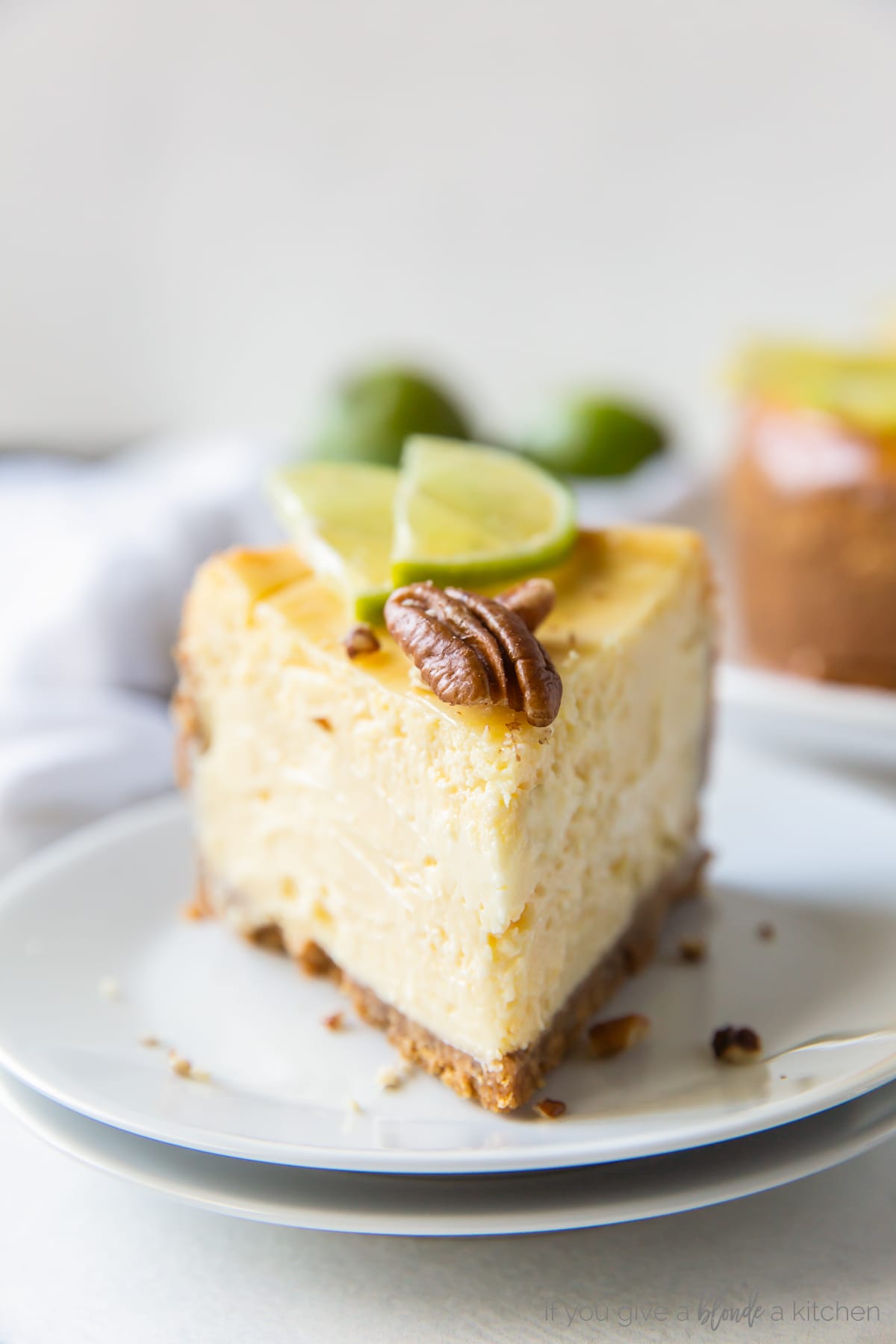 slice of lime curd cheesecake on small white round plate