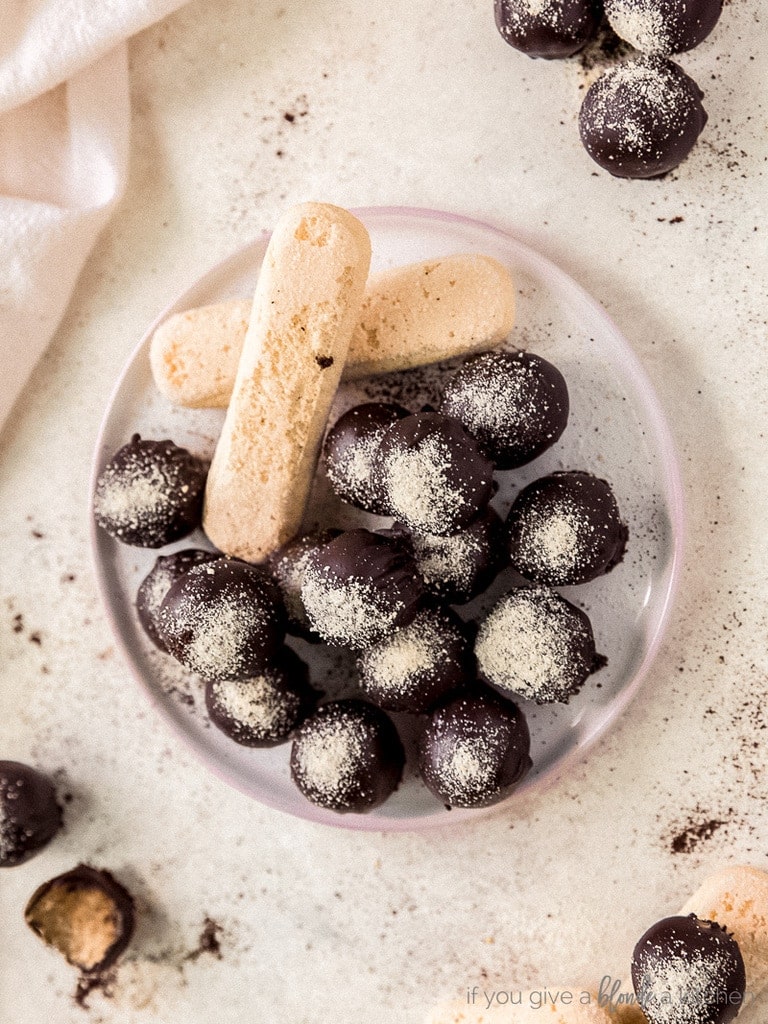 plate of chocolate dipped tiramisu truffles with two lady fingers