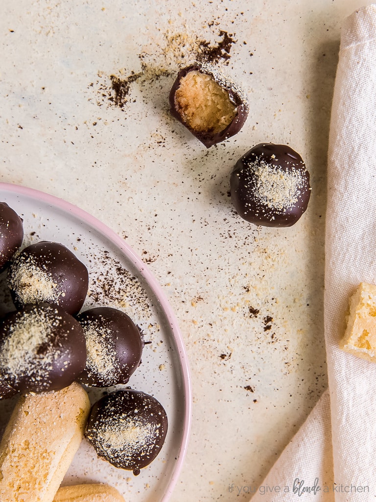 Tiramisu truffles are a wonderful blend of tiramisu flavors (think Italian biscuits, espresso and chocolate) in a delicious bite. The no bake recipe only uses six ingredients! | @haleydwilliams
