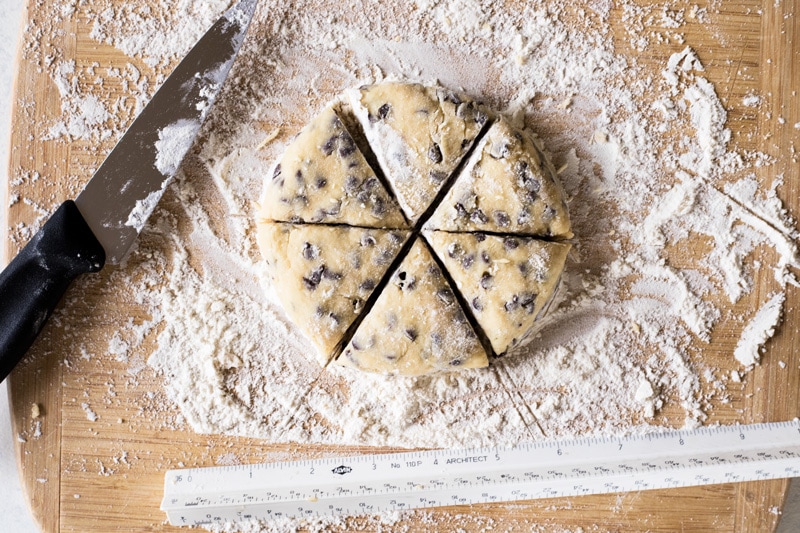 two bite chocolate chip mini scones floured work surface with ruler and knife