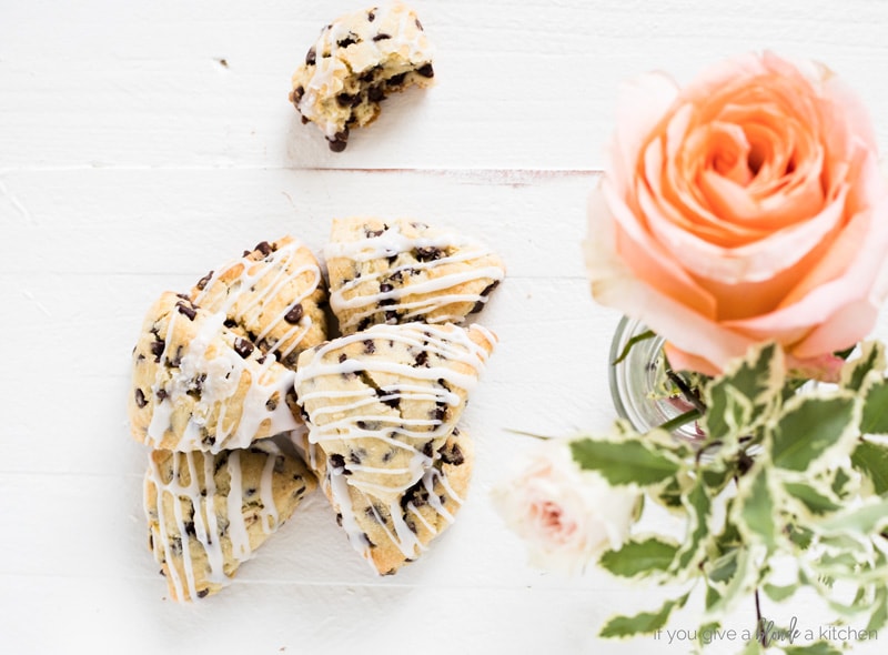 two bite chocolate chip mini scones overhead shot with flowers and eaten scone