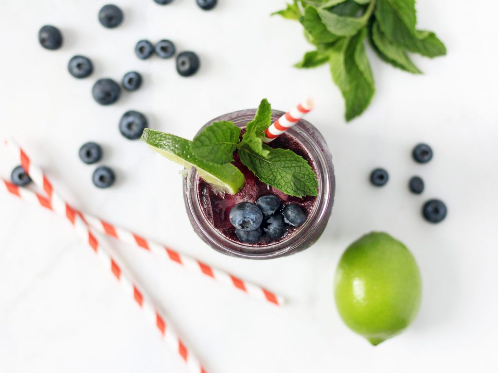 Mint-infused blueberry cocktail is refreshing, subtly sweet and gets you just the right amount of tipsy. This recipe is a must for summer! | www.ifyougiveablondeakitchen.com