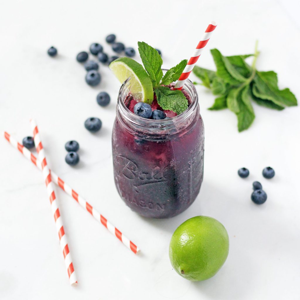 Mint-infused blueberry cocktail is refreshing, subtly sweet and gets you just the right amount of tipsy. This recipe is a must for summer! | www.ifyougiveablondeakitchen.com
