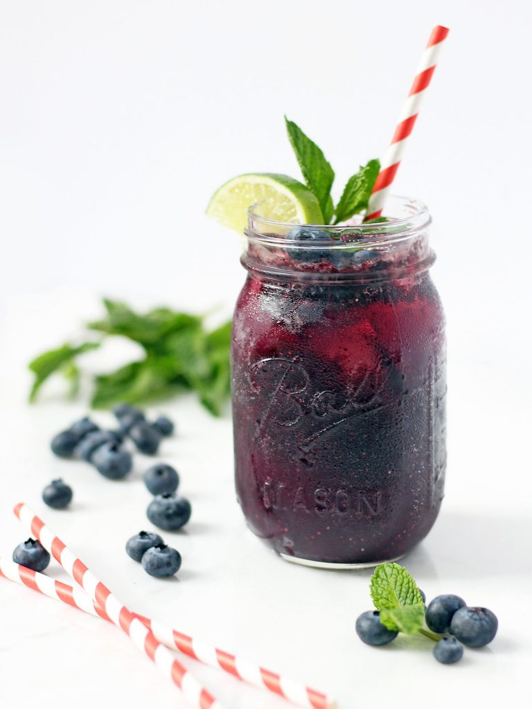 Mint-infused blueberry cocktail is refreshing, subtly sweet and gets you just the right amount of tipsy. This recipe is a must for summer! | www.ifyougiveablondeakitchen.com