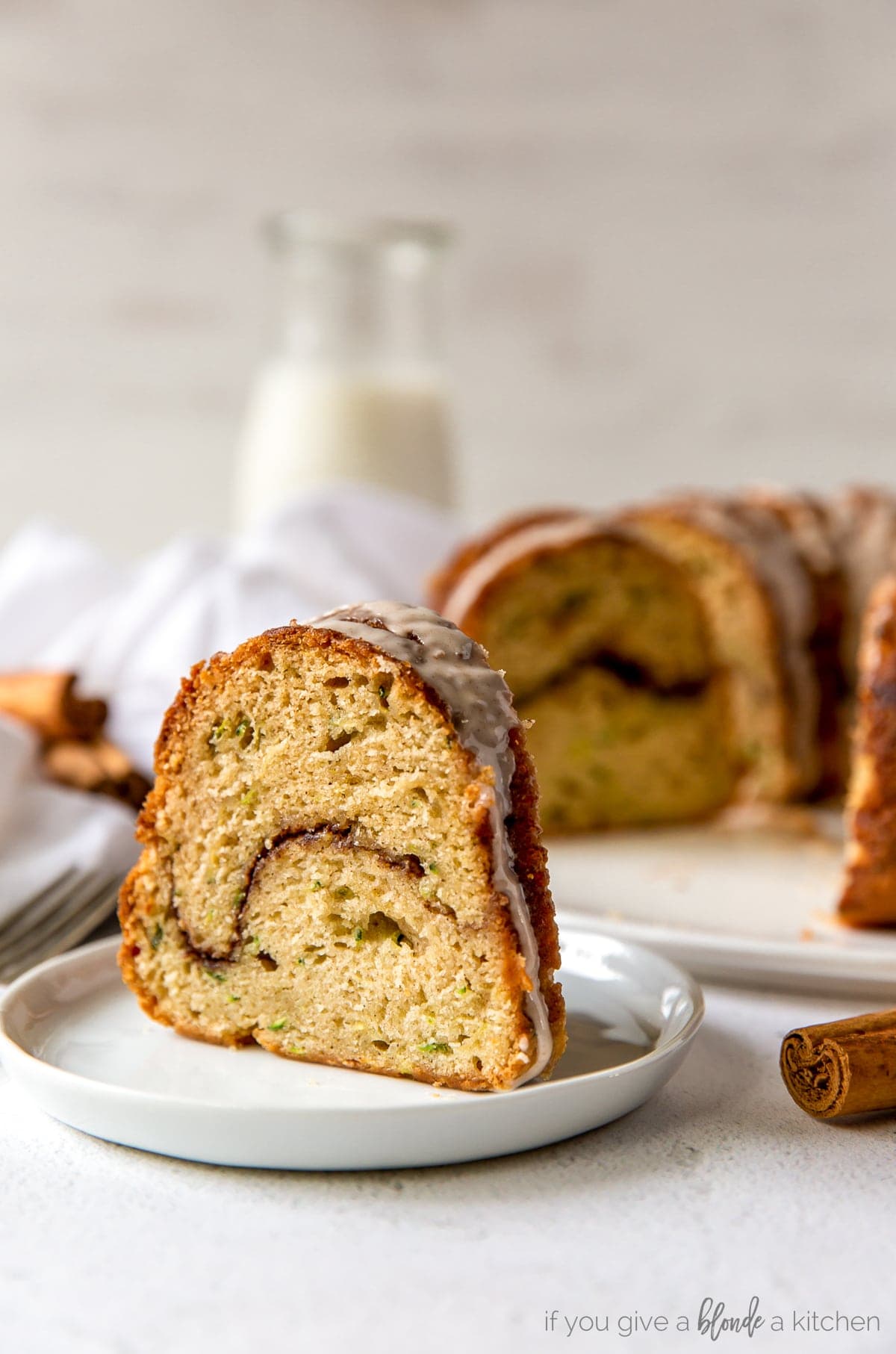 slice of cinnamon zucchini bundt cake with cinnamon swirl in the center