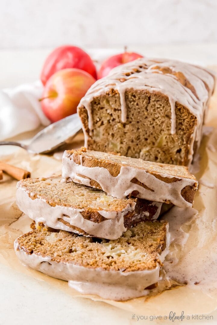 apple cider bread with cinnamon glaze and three slices cut off the loaf
