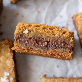 nutella blondie on its side to show layer of nutella inside