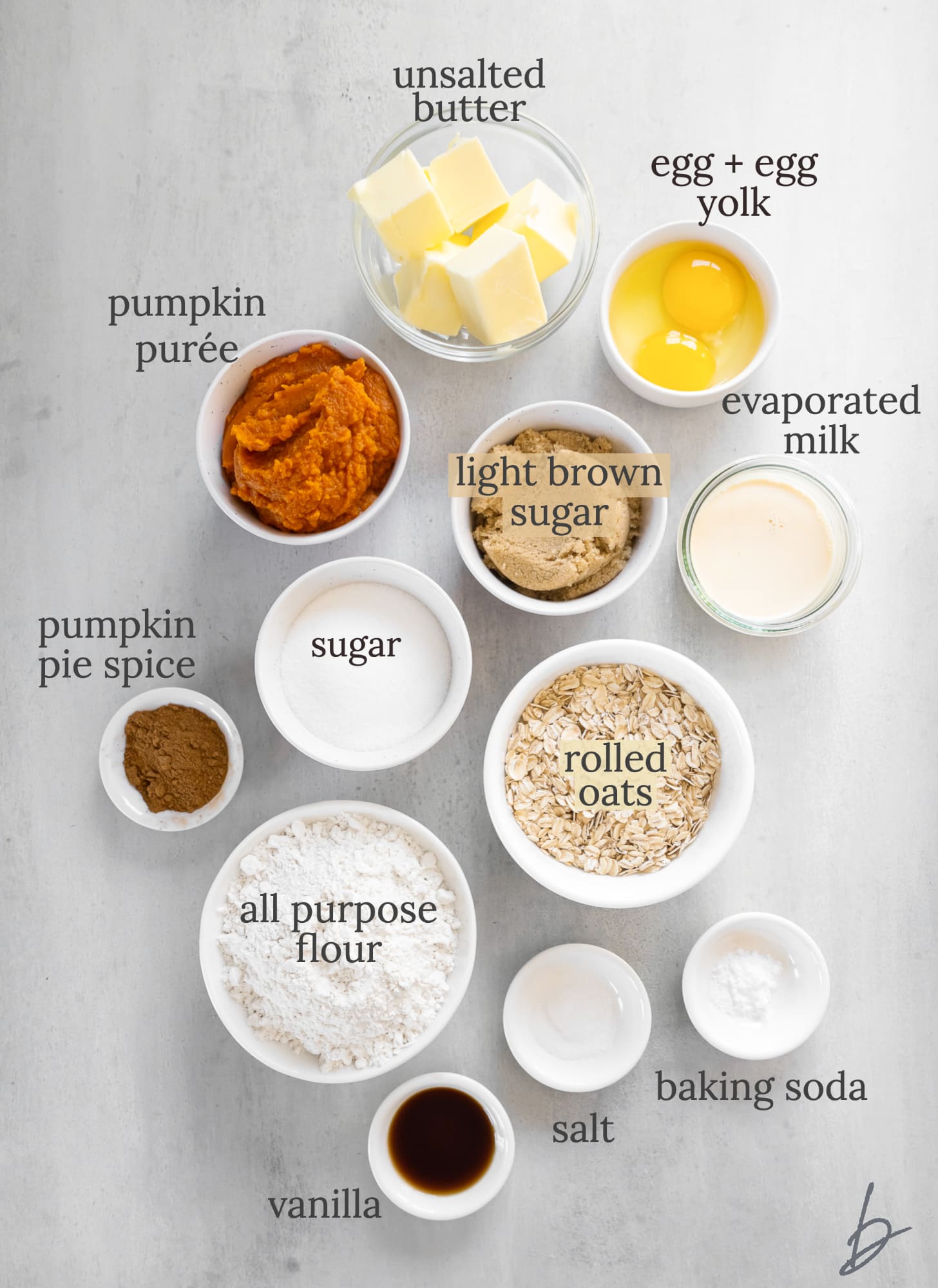 pumpkin pie bars ingredients in bowls labeled with text.