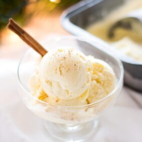 eggnog ice cream in dish with cinnamon stick