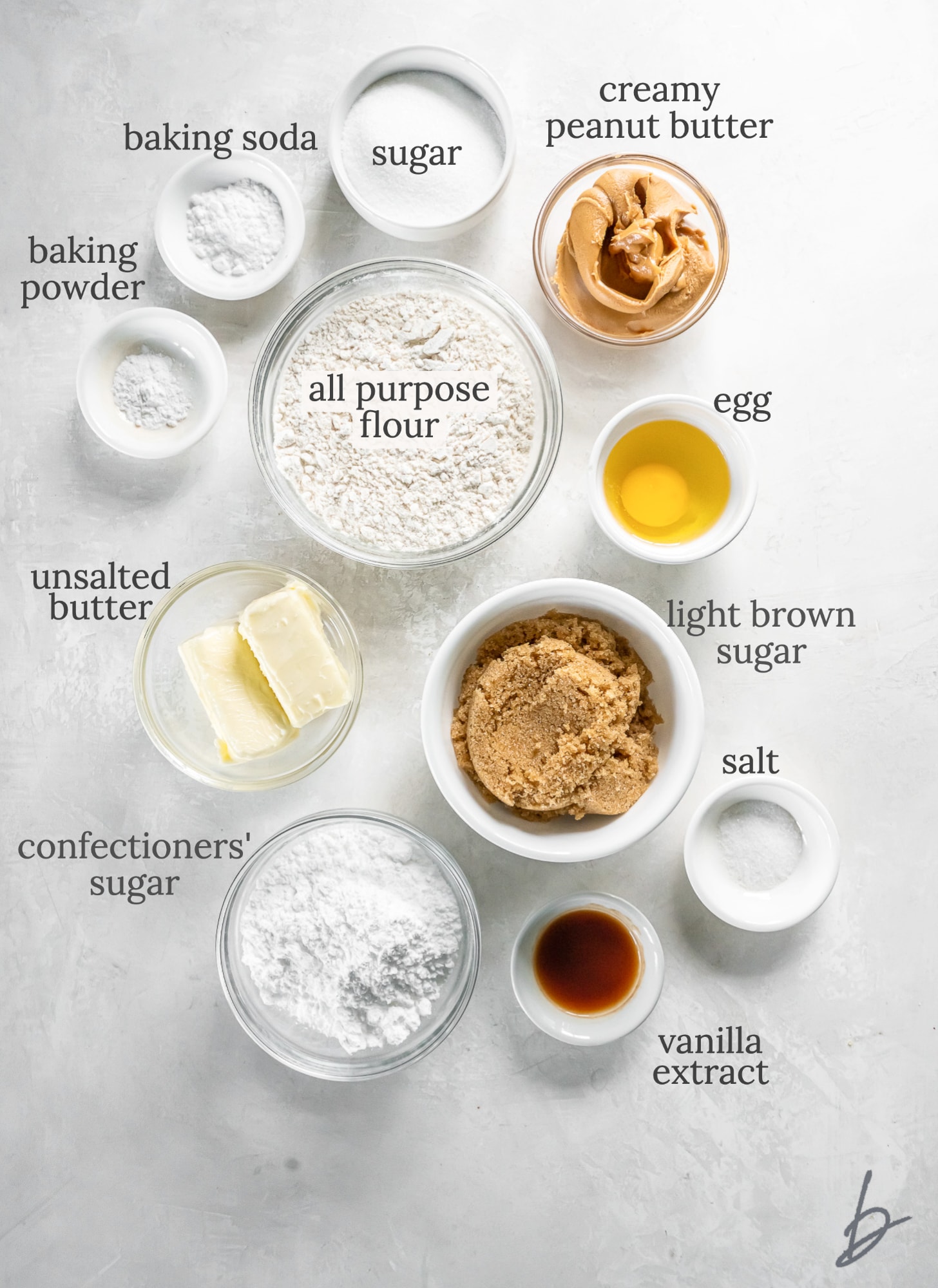 peanut butter crinkle cookies ingredients in bowls labeled with text