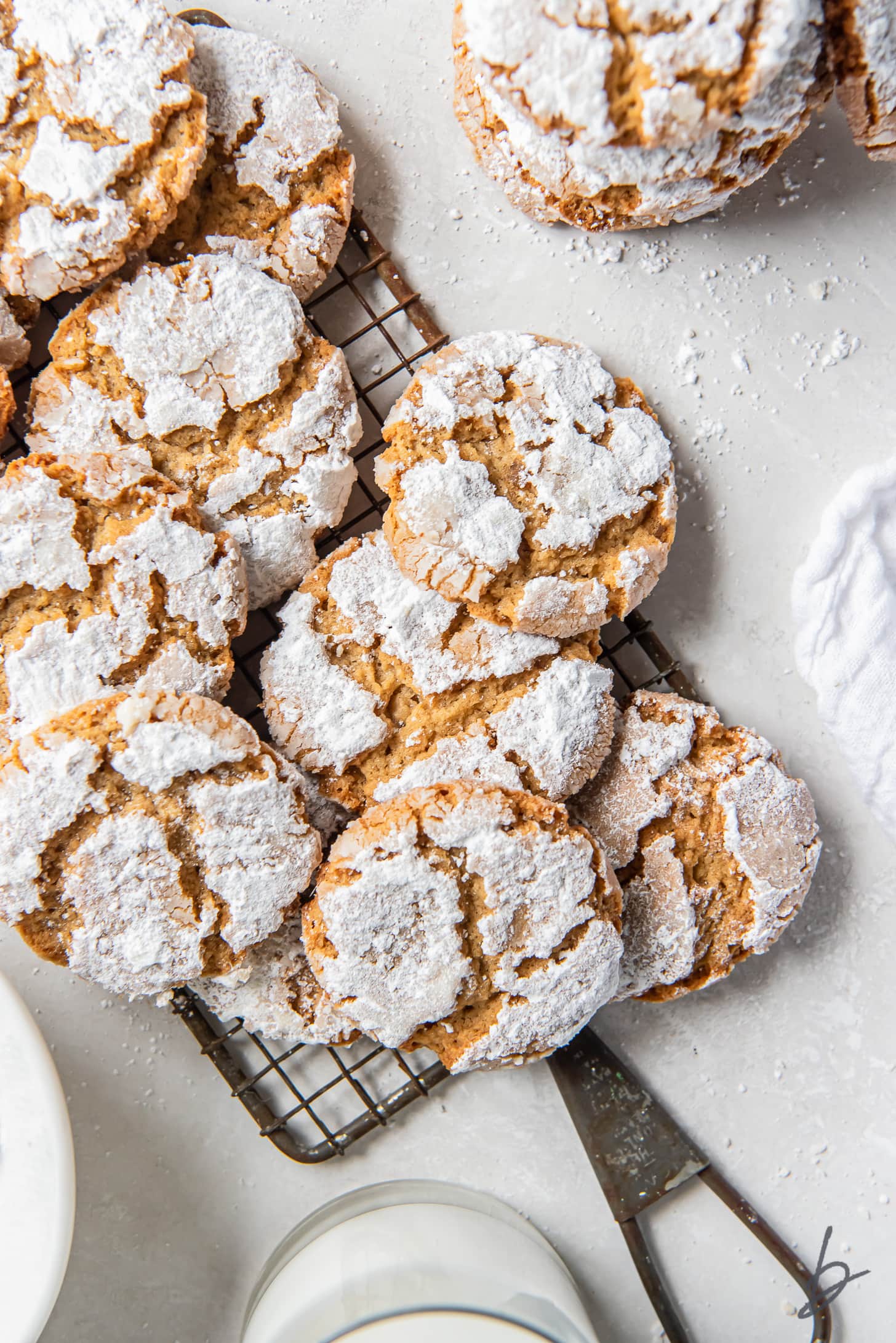 peanut butter crinkle cookies on small antique wire rack with handle