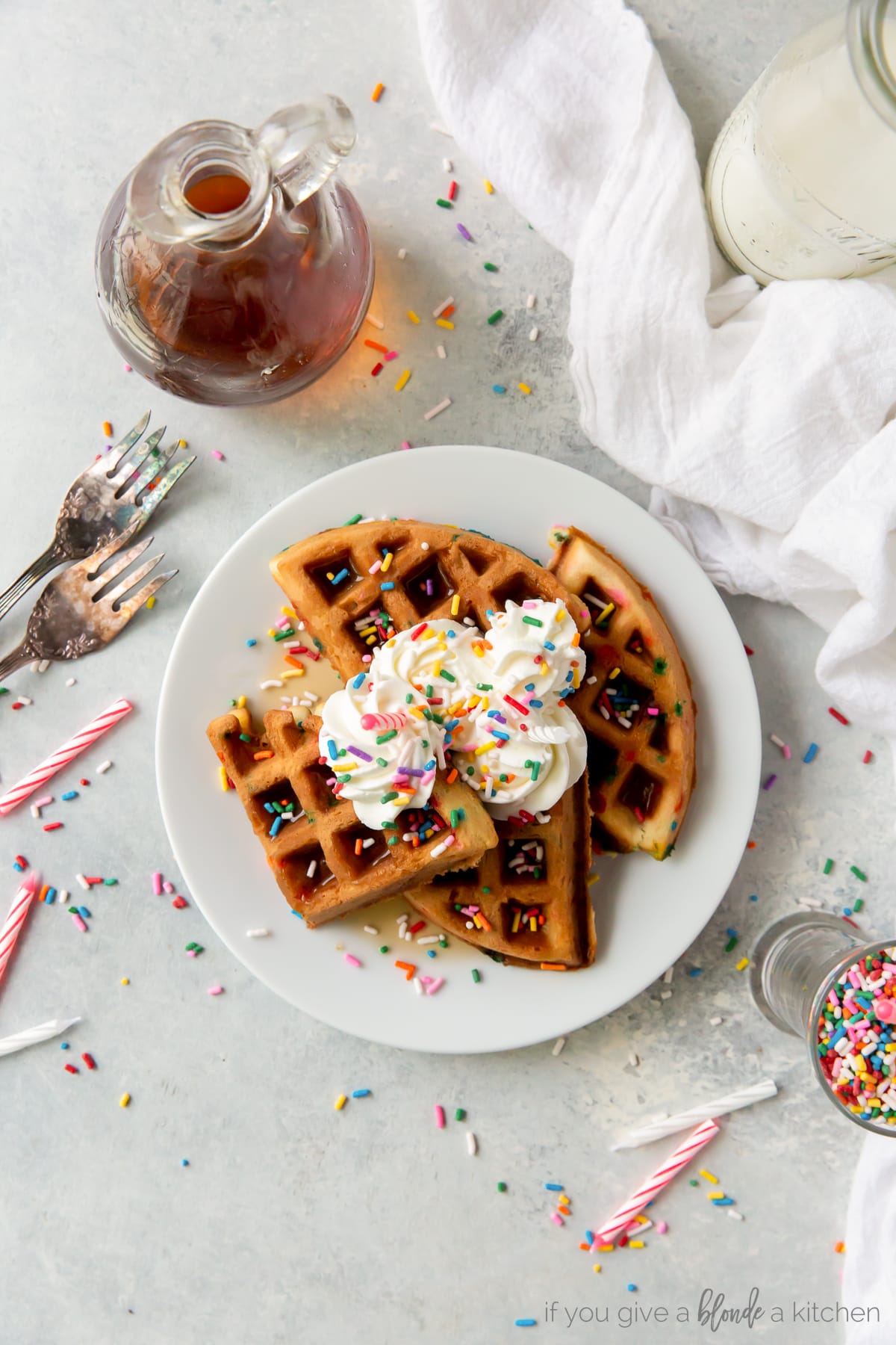 for and knife cutting sprinkle waffles with whipped cream