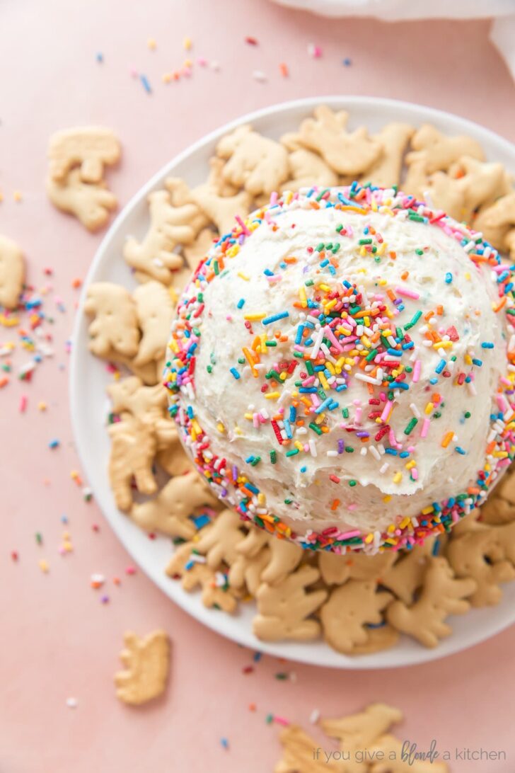 funfetti dip with bowl of rainbow sprinkles and animal crackers