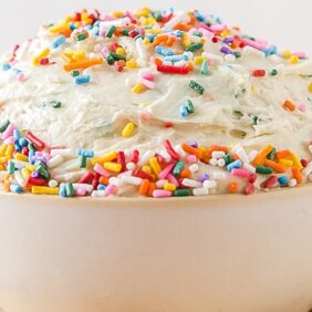 bowl of funfetti cake dip with rainbow sprinkles