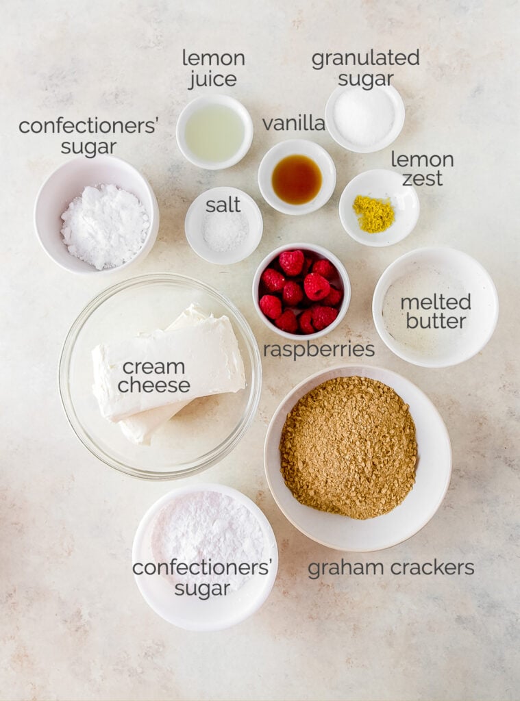 ingredients for no bake raspberry cheesecake bars in bowls with text