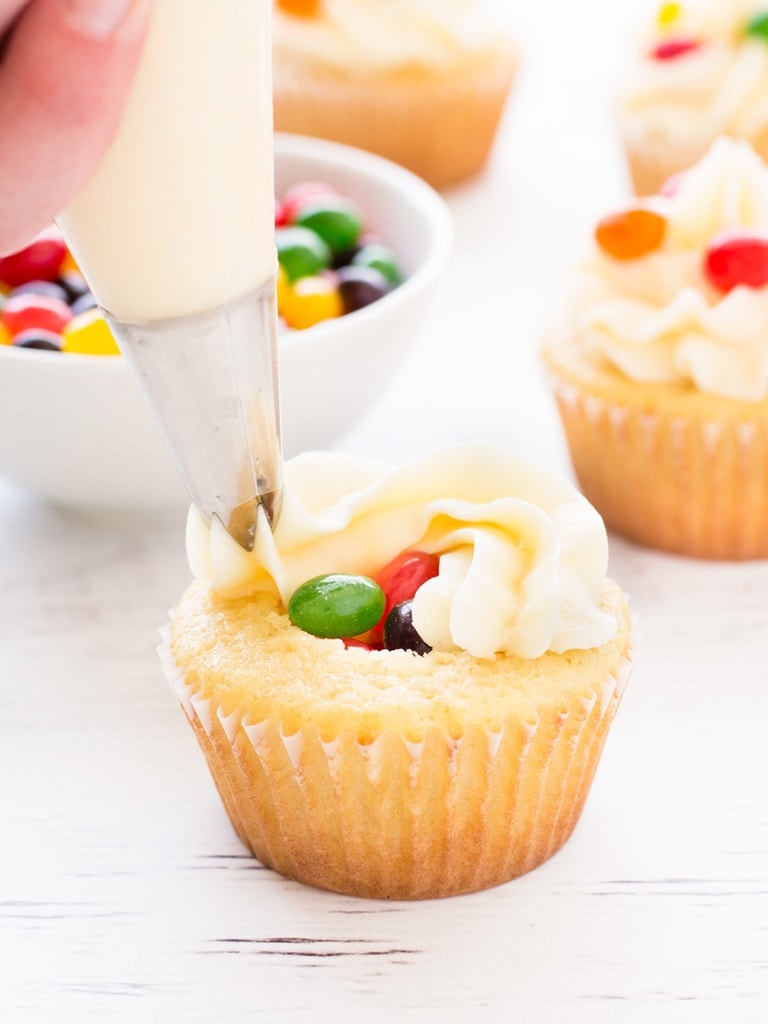 Jelly bean cupcakes are simple vanilla cupcakes decorated with jelly beans inside and out! Perfect for Easter. | www.ifyougiveablondeakitchen.com