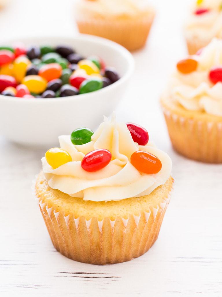 Jelly bean cupcakes are simple vanilla cupcakes decorated with jelly beans inside and out! Perfect for Easter. | www.ifyougiveablondeakitchen.com