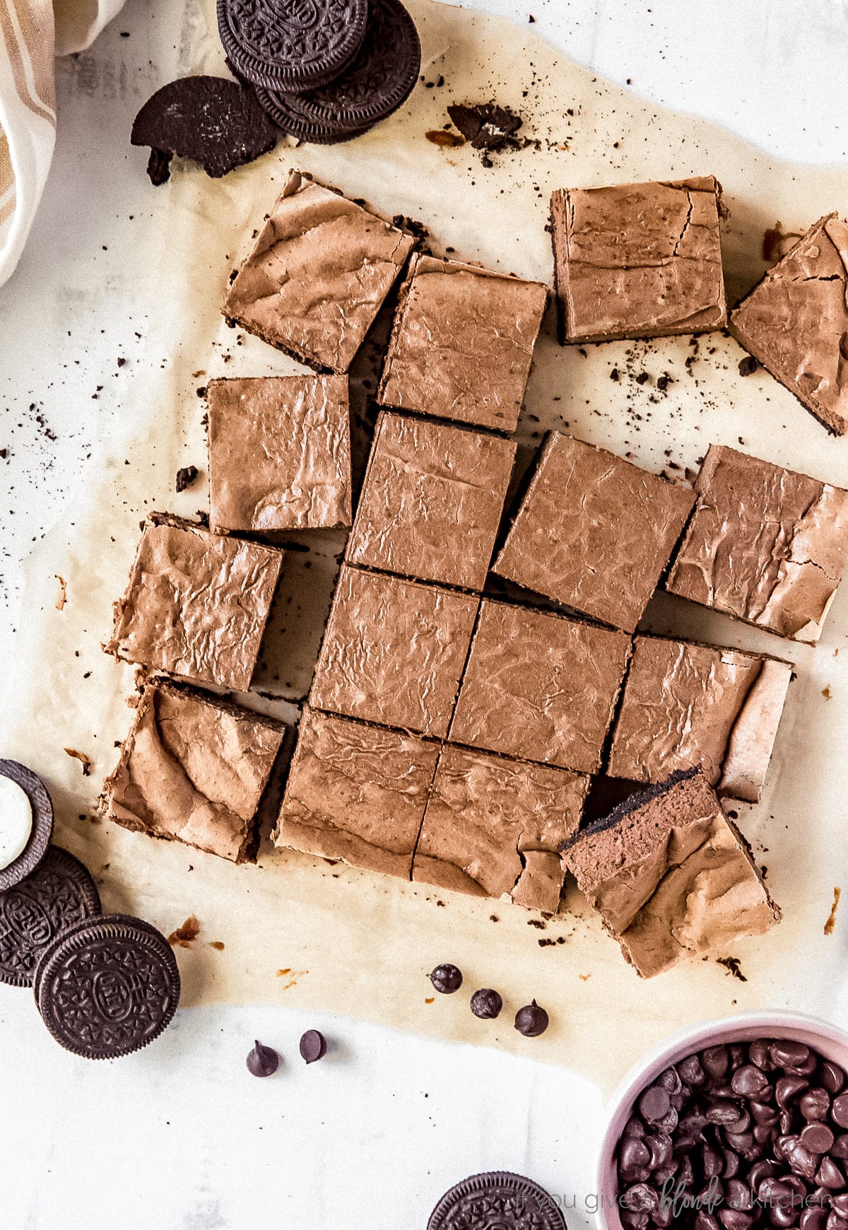 Chocolate cheesecake bars with Oreo crust laid flat on a table.