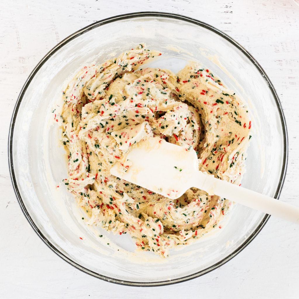 edible sugar cookie dough in glass bowl with spatula