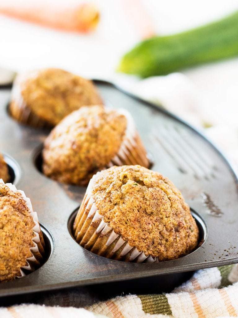 carrot zucchini muffin on its side in muffin tin