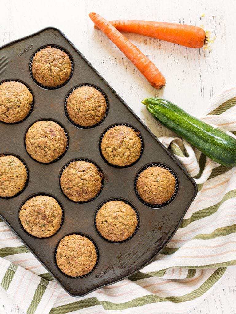 muffin tin of muffins with carrot and zucchini