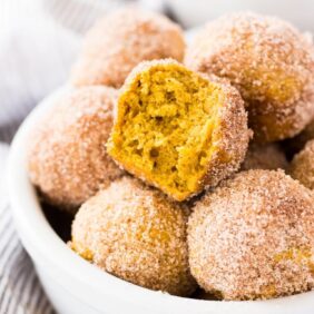 Mini pumpkin donut muffins are coated in cinnamon sugar. This recipe is a fun treat to bake for fall! | www.ifyougiveablondeakitchen.com