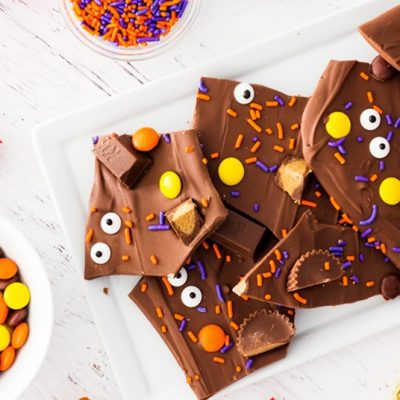 Halloween candy bark with sprinkles, candy eyes, Reese's and Kit Kats. | www.ifyougiveablondeakitchen.com