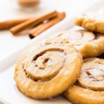 Cinnamon roll cookies are buttery, flakey and layered with cinnamon sugar goodness. This recipe is perfect for the holidays or when you're craving a sweet treat! | www.ifyougiveablondeakitchen.com