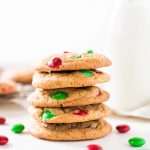 Christmas M&M cookies stacked on top of each other with red and green candies