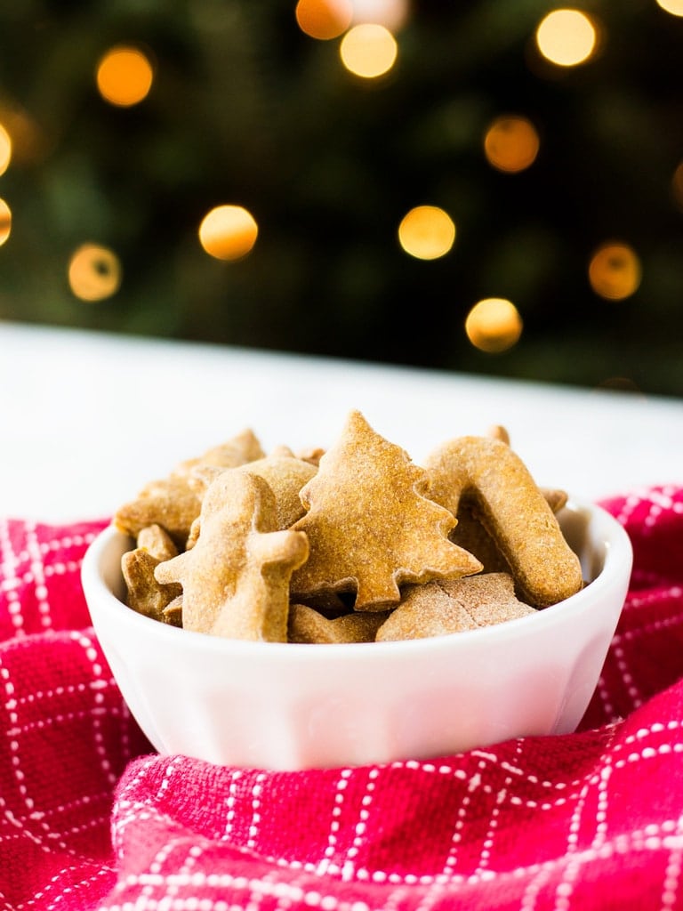 Homemade peanut butter dog treats are fun to make with Christmas cookie cutters. This easy recipe makes a lot of treats that your puppy will love! | www.ifyougiveablondeakitchen.com