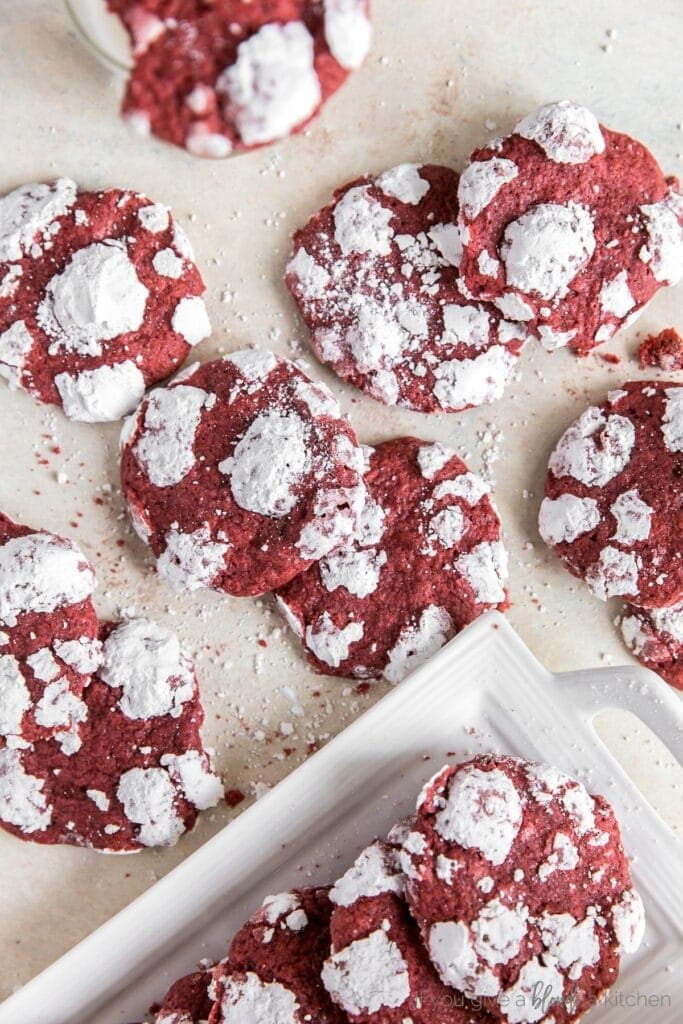 red velvet crinkle cookies with powdered sugar scattered on surface