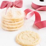 These sugar cookies are stamped with messages for santa. Put the stamp cookies in a bag tied with a bow for a sweet gift! | www.ifyougiveablondeakitchen.com