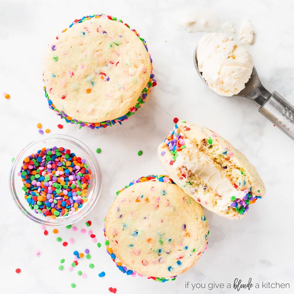 Birthday cake ice cream sandwiches are an easy homemade dessert. Make sprinkle sugar cookies from scratch and sandwich in the center! Add sprinkles for a fun touch. | www.ifyougiveablondeakitchen.com