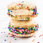 Birthday cake ice cream sandwiches are an easy homemade dessert for summer. Use rainbow sprinkles and homemade sugar cookies to make this sweet treat! | www.ifyougiveablondeakitchen.com