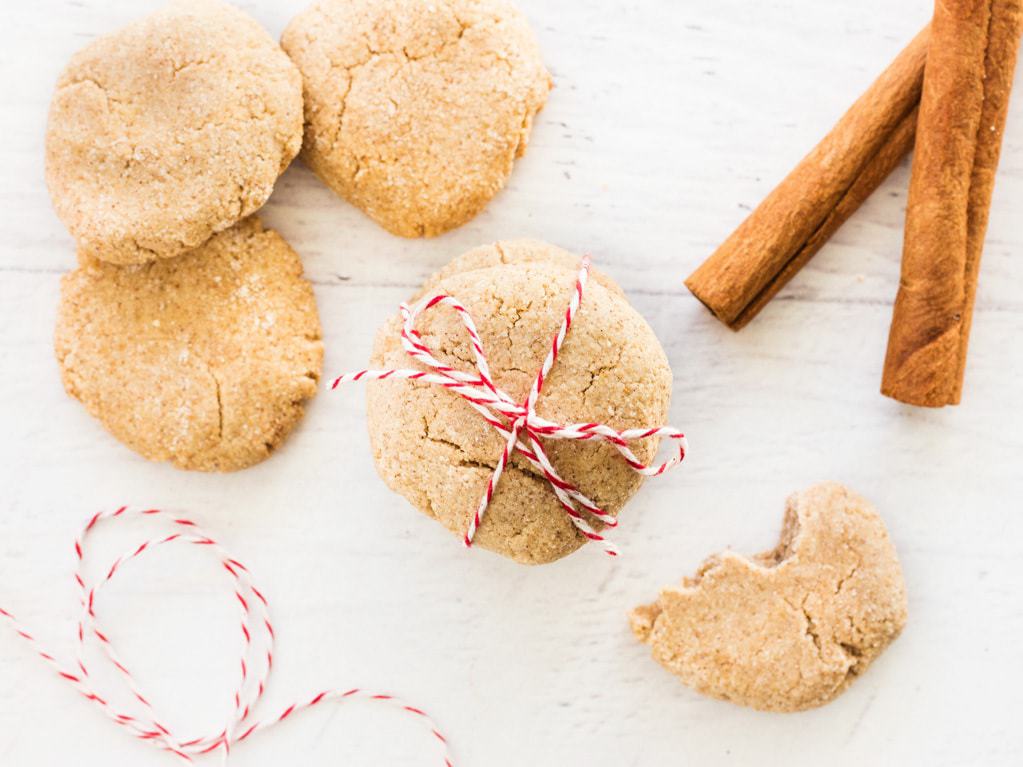 Snickerdoodle cinnamon dog treats overhead shot with red yarn and cinnamon sticks