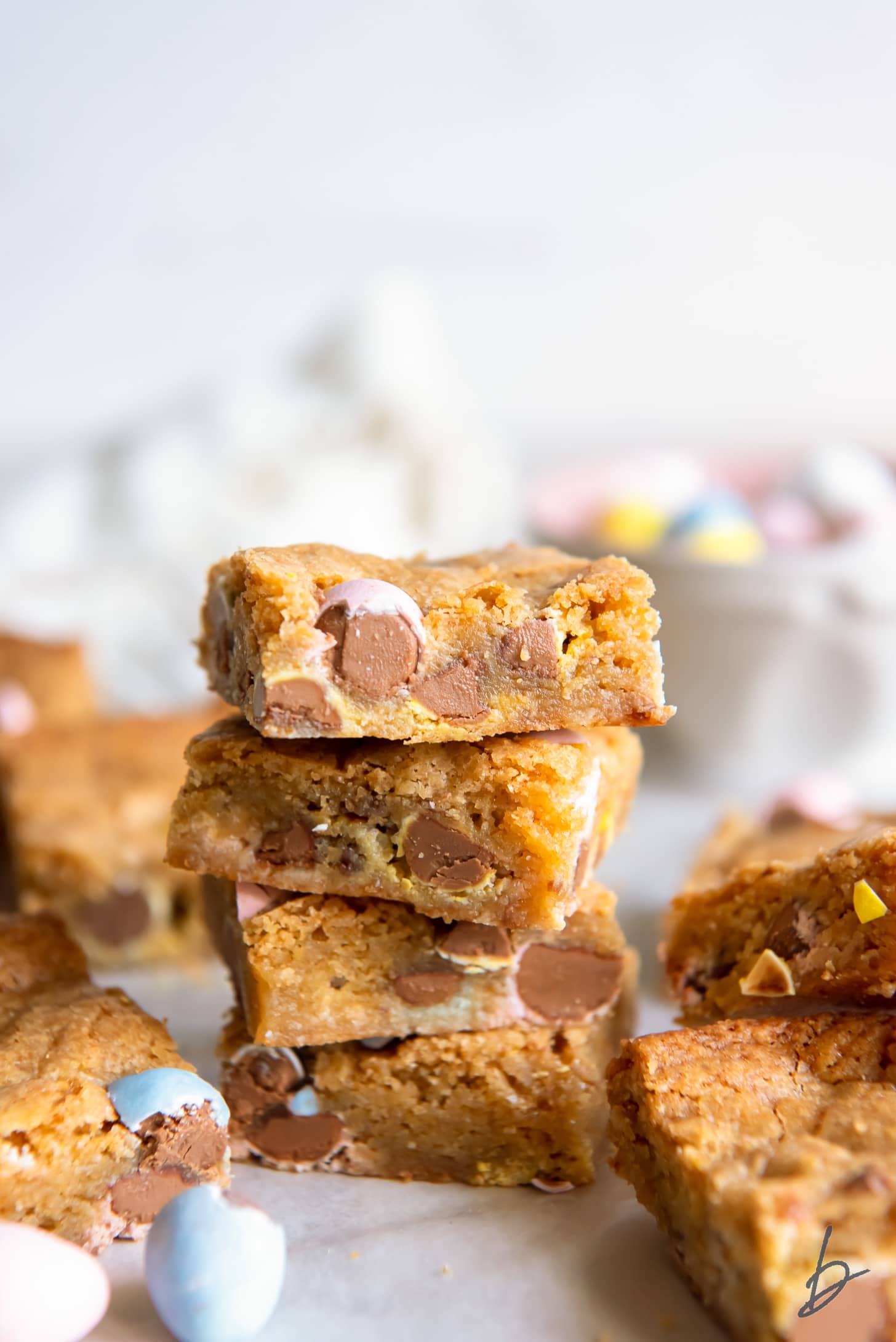 stack of mini egg Easter blondies with pastel Cadbury mini eggs