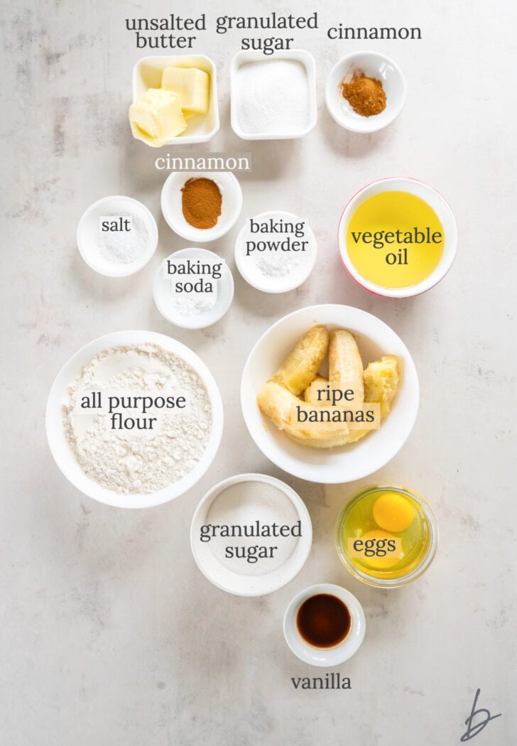 banana cinnamon muffin ingredients in bowls labeled with text
